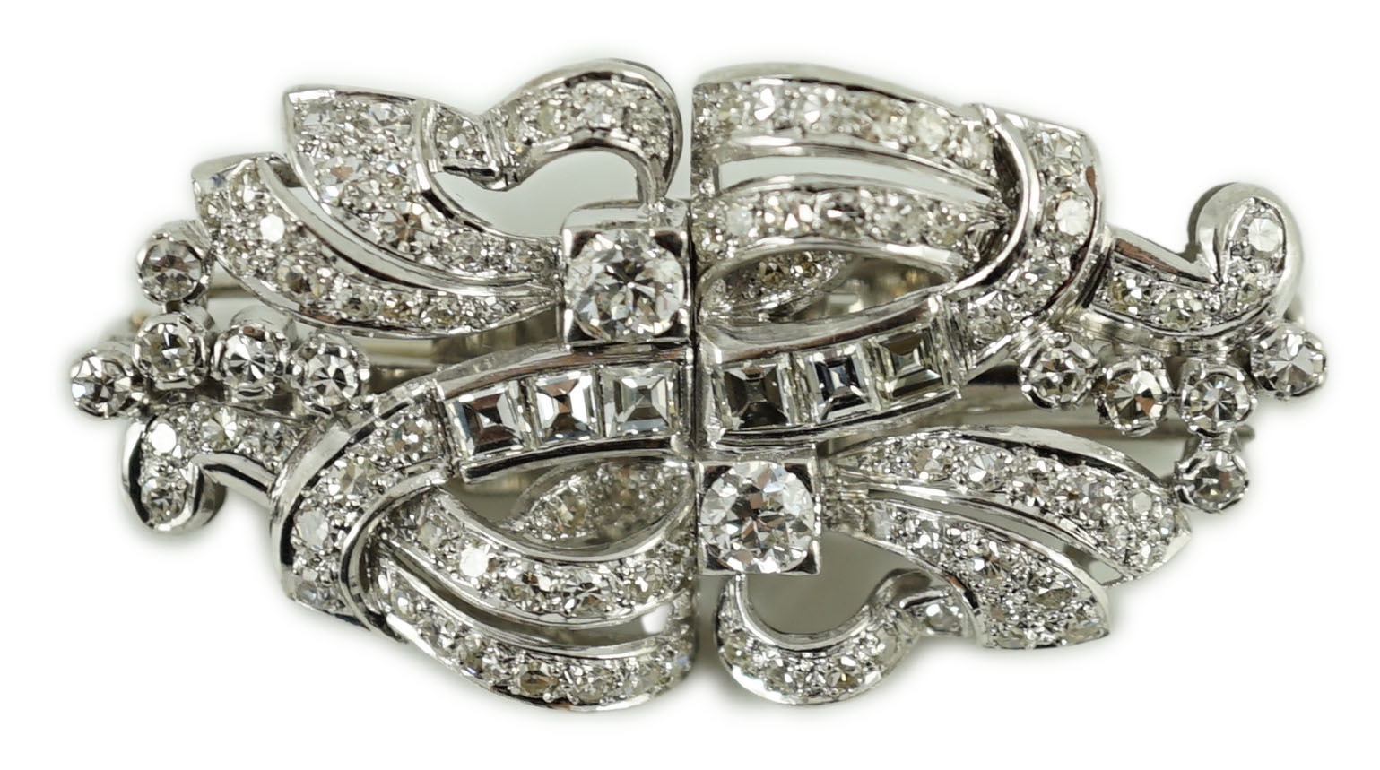 A mid 20th century platinum and diamond cluster double clip brooch